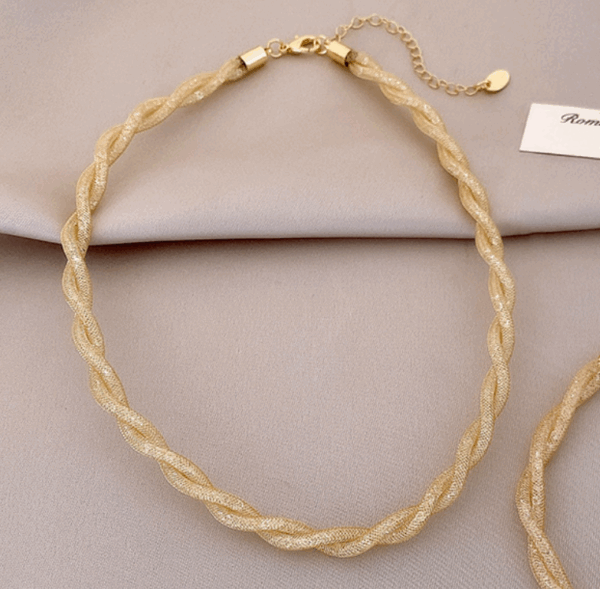 c9dd112112742caf4fc431316123e42 Lumière Twist Mesh Necklace