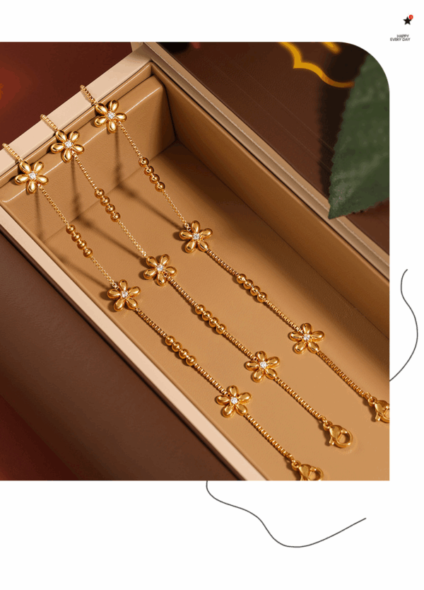 095cbcfa9aea2d181e962d8ae751f55 Gold-Plated Daisy Charm Bracelet – Zircon Accent & Titanium Steel