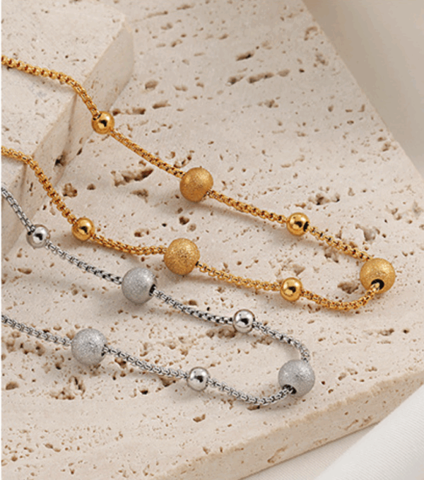 0be012314b3c4e7e93dc7b2cc2b7be7 Golden Daisy Chain Bracelet – Titanium Steel with Zircon Petals