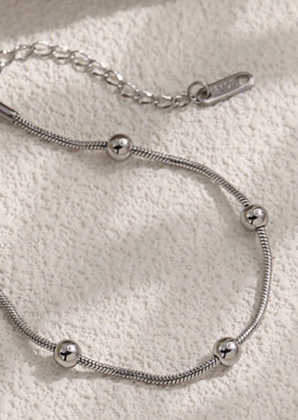 Titanium Steel Snake Chain Bracelet with Polished Beads – Adjustable Fit
