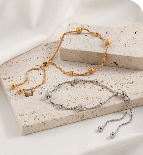 2c3fc83fe01fc02dabd9a91efc77cba Golden Daisy Chain Bracelet – Titanium Steel with Zircon Petals