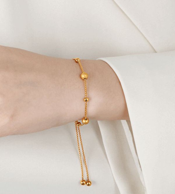 2f3a6584ec6793606fe99ab32b4c077 Golden Daisy Chain Bracelet – Titanium Steel with Zircon Petals
