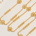 Triple Daisy Chain Bracelet – Gold Titanium Steel with Floral Accents
