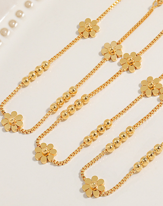 42998bd259d94549e4f8c42d4396333 Triple Daisy Chain Bracelet – Gold Titanium Steel with Floral Accents