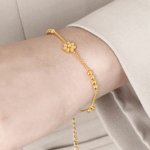 Triple Daisy Chain Bracelet – Gold Titanium Steel with Floral Accents