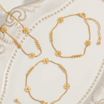 Triple Daisy Chain Bracelet – Gold Titanium Steel with Floral Accents