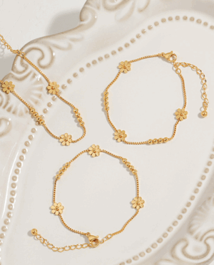 Triple Daisy Chain Bracelet – Gold Titanium Steel with Floral Accents